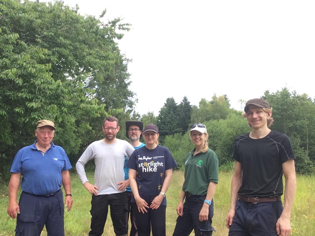A group of men standing in a field

Description automatically generated with low confidence