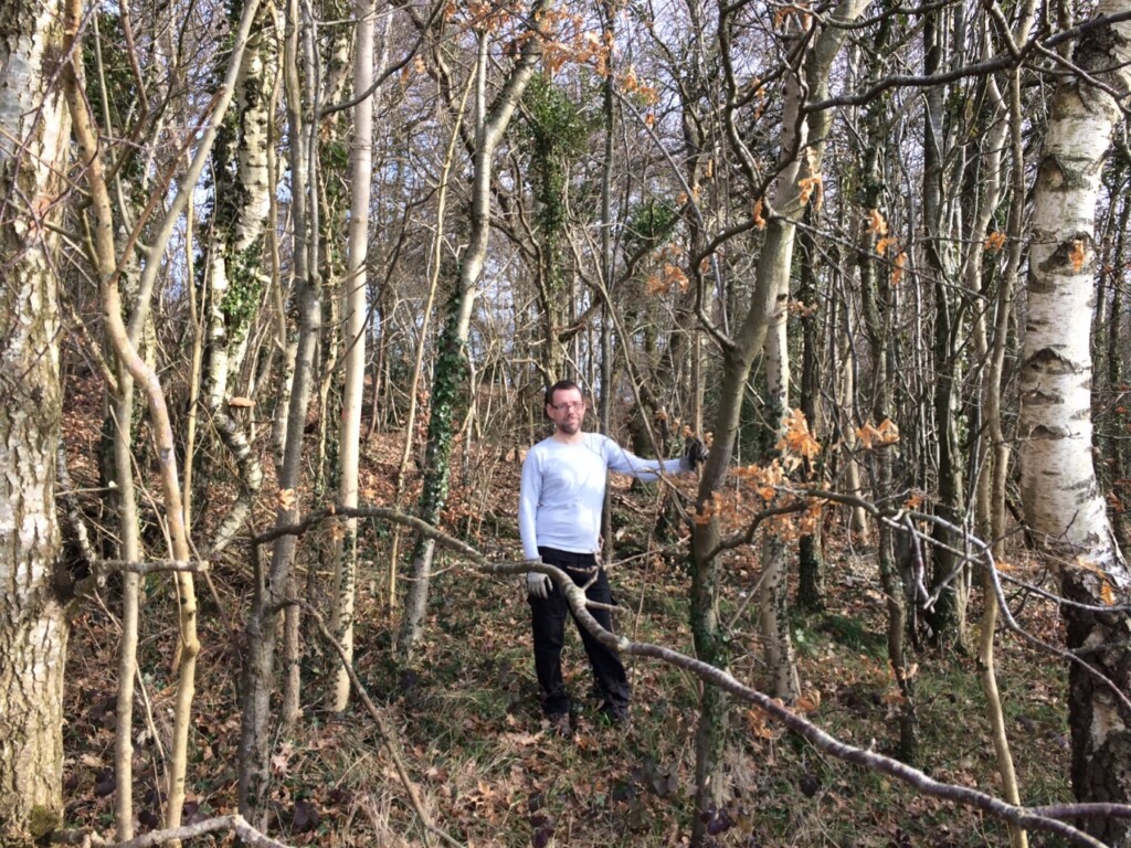 A person standing in a forest

Description automatically generated with medium confidence