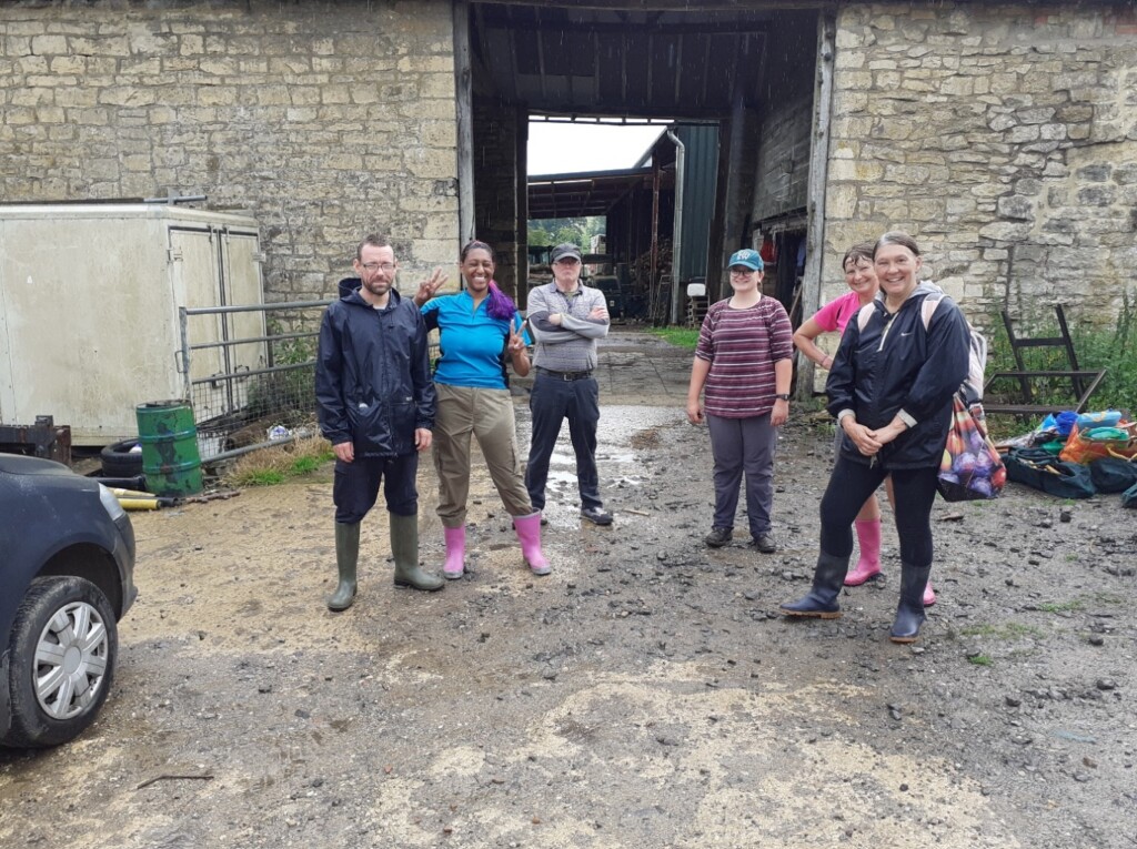 A group of people standing outside a building

Description automatically generated with medium confidence