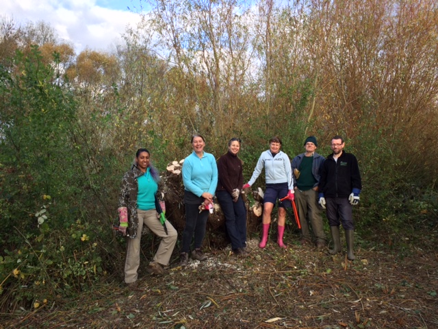 A group of people posing for a photo in the woods

Description automatically generated with medium confidence