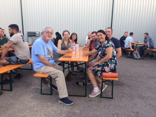 A group of people sitting at tables

Description automatically generated with medium confidence