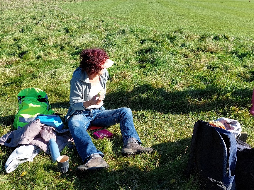 A person sitting on the grass

Description automatically generated